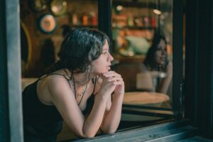 Thoughtful woman reflecting on overriding yourself and the small moments that shape change