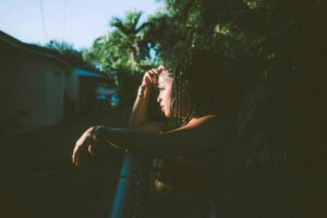 Woman in quiet reflection representing the journey of finding your true self